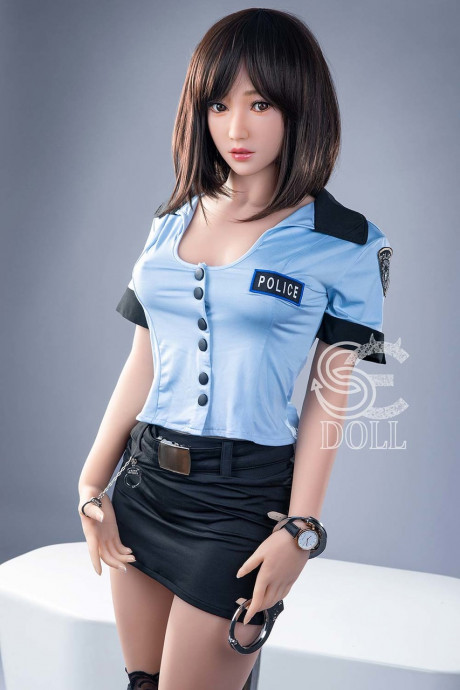 Beautiful oriental sex doll shows her pretty titties in a police uniform - #981049