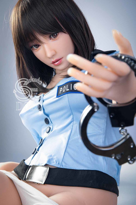 Beautiful oriental sex doll shows her pretty titties in a police uniform - #981050