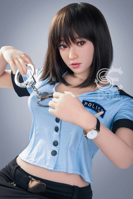 Beautiful oriental sex doll shows her pretty titties in a police uniform - #981056