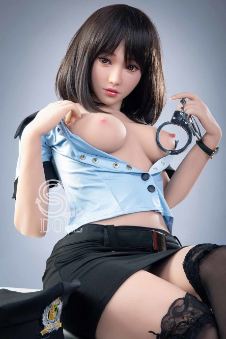Beautiful oriental sex doll shows her pretty titties in a police uniform - #981063