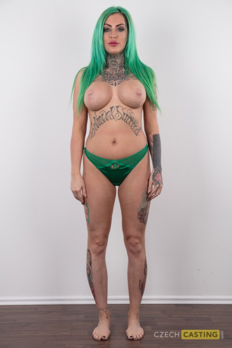 Tattooed slut gf girl with green hair and pierced nipples stands naked after disrobing - #2116
