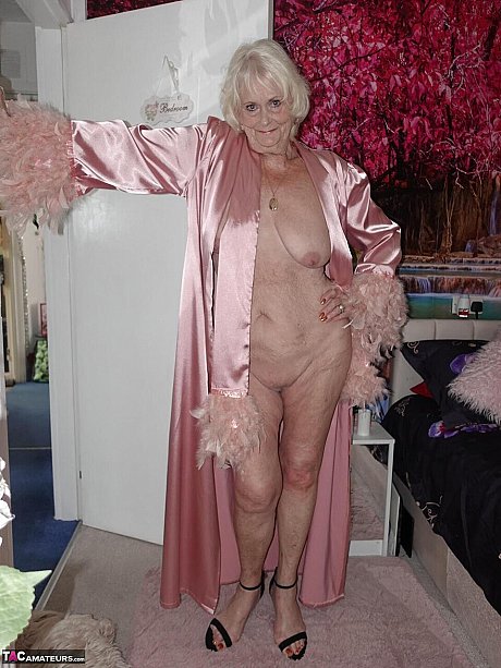 Yellow-haired grandma Sparkle exposes her saggy titties and shaved twat in a satin robe - Image 10 of 16  in Pussy category   featuring Sparkle 
