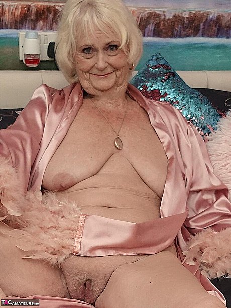 Yellow-haired grandma Sparkle exposes her saggy titties and shaved twat in a satin robe - Image 13 of 16  in Pussy category   featuring Sparkle 