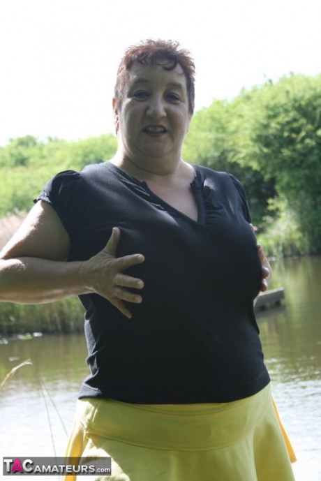Older redhead wild Carol exposes her bra and underwear near the water - #116840
