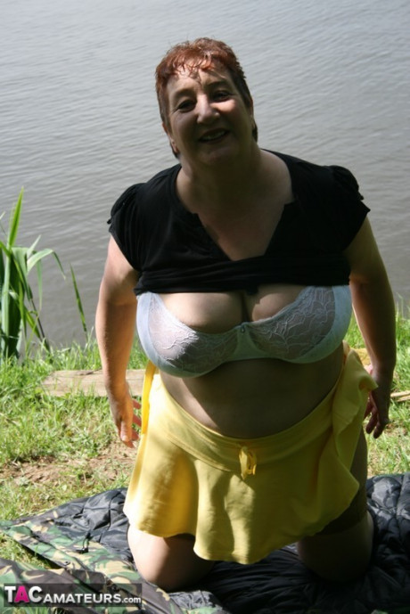 Older redhead wild Carol exposes her bra and underwear near the water - #116851