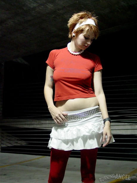 Nice ginger head Aurie strips in the dark and shows her natural tits outdoors