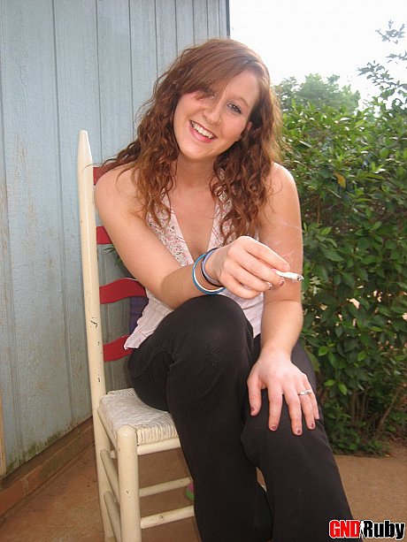 Young teenie ginger head flashes a boob while having a cigarette on a back porch - Image 10 of 12  in Outdoor category  