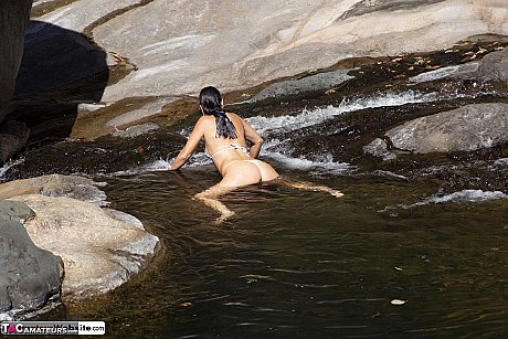 Brunette MILF Roxeanne models a bikini while wading in a stream - Image 8 of 16  in Close Up category   featuring Roxeanne 