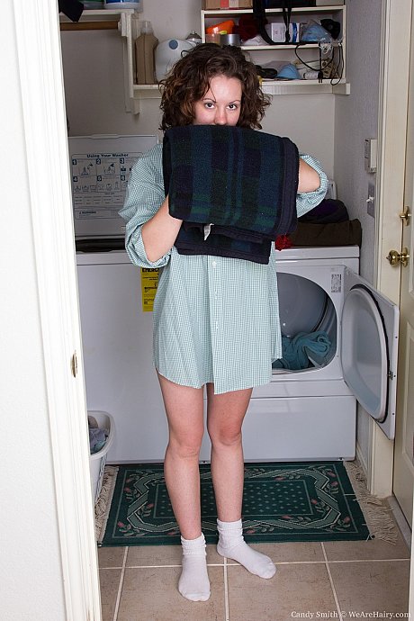 Petite beauty with bushy snatch Candy Smith undresses in laundry room