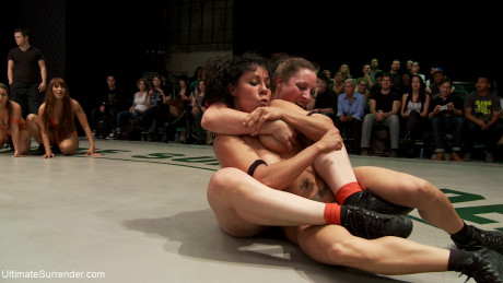 Curvaceous sporty lesbians strip and fuck during a wrestling match