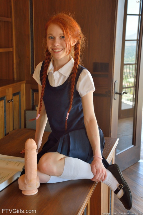Ginger schoolgirl Dolly inserts a large fake schlong & Ben Wa balls into her twat