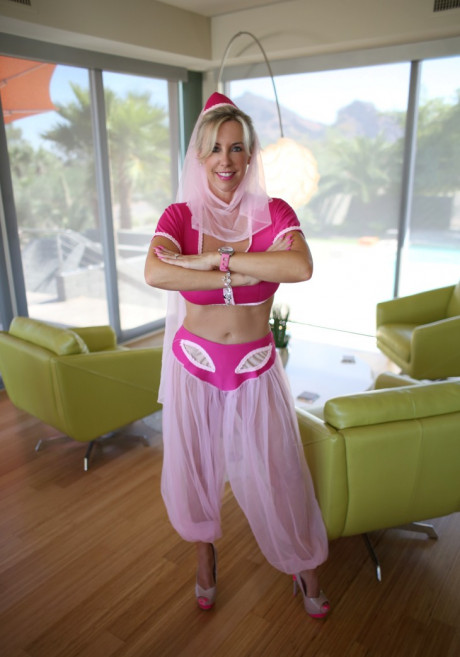 Lovely blonde housewife releases her hooters from Jeanie outfit