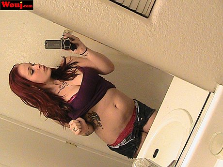 Redheaded amateur babe WouJ teases with her hot cleavage in the mirror - Image 2 of 15  in Babe category   featuring Mia Rosette 