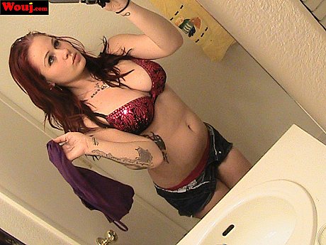 Redheaded amateur babe WouJ teases with her hot cleavage in the mirror - Image 4 of 15  in Babe category   featuring Mia Rosette 