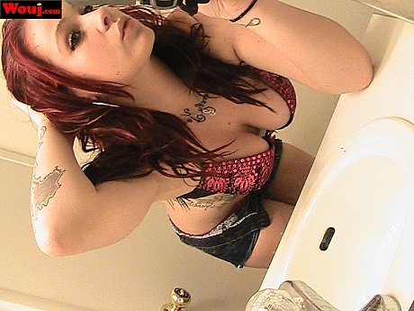 Redheaded amateur babe WouJ teases with her hot cleavage in the mirror - Image 7 of 15  in Babe category   featuring Mia Rosette 