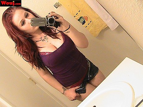 Redheaded amateur babe WouJ teases with her hot cleavage in the mirror - Image 15 of 15  in Babe category   featuring Mia Rosette 