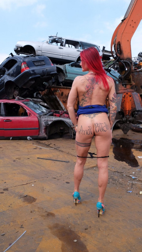 Ginger MILF with tattoos and fake boobies gets pounded in a junk yard 3some - #3361