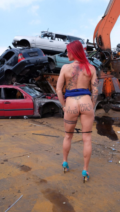 Ginger MILF with tattoos and fake boobies gets pounded in a junk yard 3some - #3362