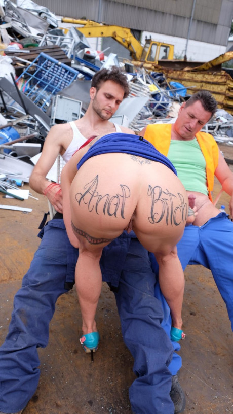 Ginger MILF with tattoos and fake boobies gets pounded in a junk yard 3some - #3368