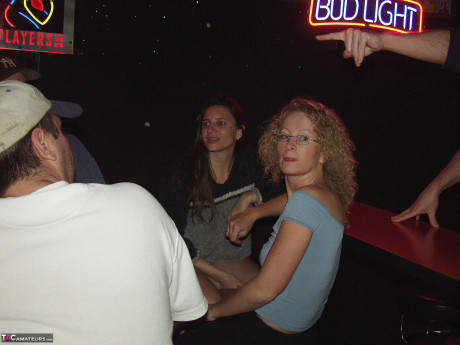 Red Hair Klixen engages in lesbian sex inside a dive nightclub