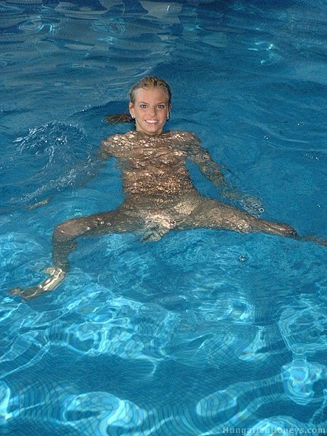 Charming yellow-haired teen Lilu plays nude in the pool before posing with two males