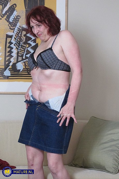 Redheaded mature girl Claudia C toying her thick pussy on the sofa - Image 3 of 20  in Amateur category   featuring Claudia C 