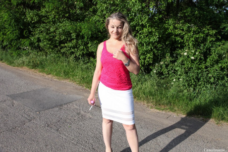 Lovely cougar Laura shows her behind and vagina and sticks a toy in it outdoors - #1081318