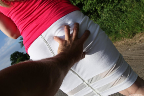 Lovely cougar Laura shows her behind and vagina and sticks a toy in it outdoors - #1081322