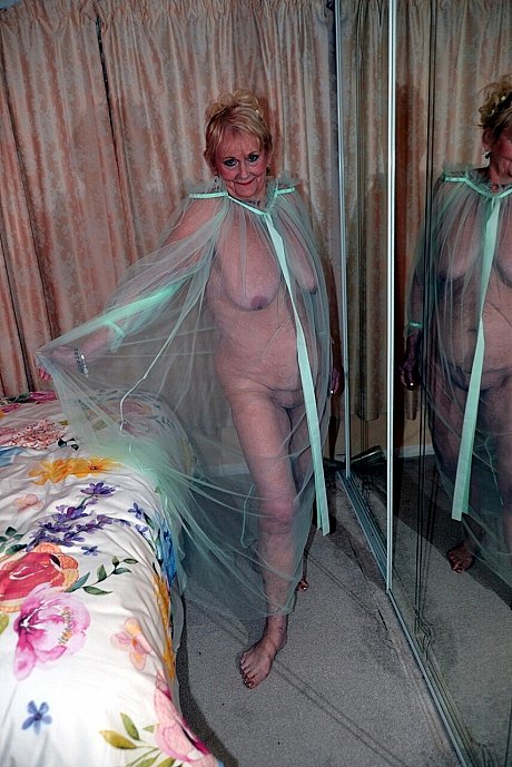 Old blonde Sparkle poses in a sheer garment while otherwise totally undressed - xxx porn gallery #50789 in Legs featuring Sparkle