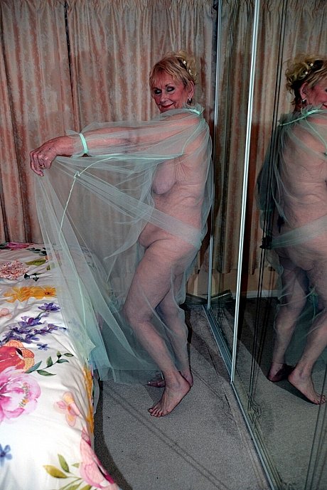 Old blonde Sparkle poses in a sheer garment while otherwise totally undressed - Image 4 of 16  in Legs category   featuring Sparkle 