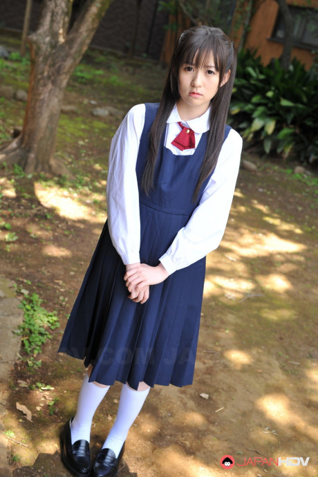 Charming Japanese babe posing in her attractive school outfit in the garden - #1036270