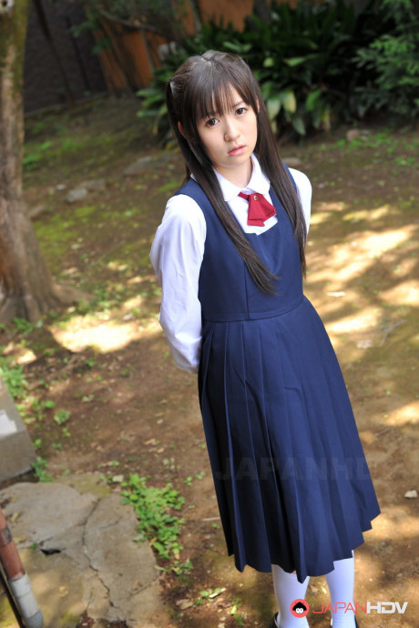 Charming Japanese babe posing in her attractive school outfit in the garden - #1036272