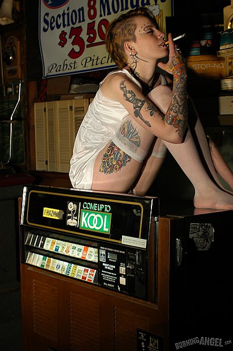 Babe with short hair and heavy tattoos is a striptease at an empty bar - Image 1 of 19  in Spreading category   featuring Rachel Face 