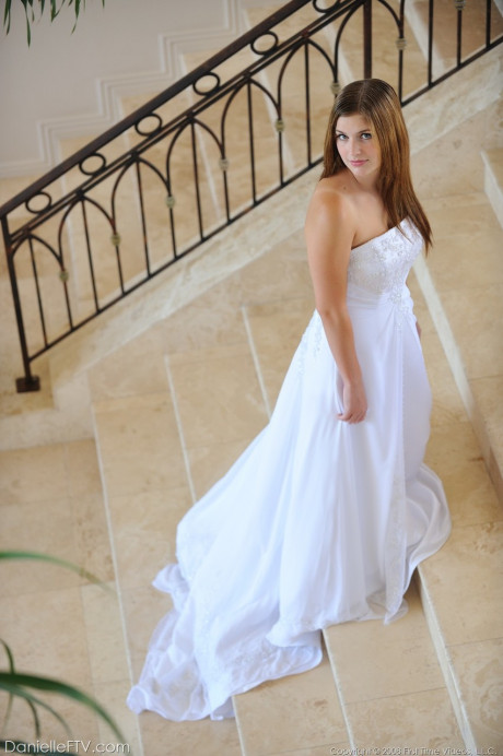 Busty glamorous amateur Danielle models wedding gown indoors & by the pool - #738760