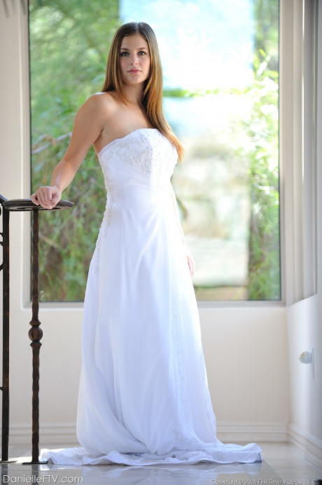 Busty glamorous amateur Danielle models wedding gown indoors & by the pool - #738762
