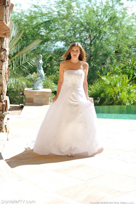 Busty glamorous amateur Danielle models wedding gown indoors & by the pool - #738774