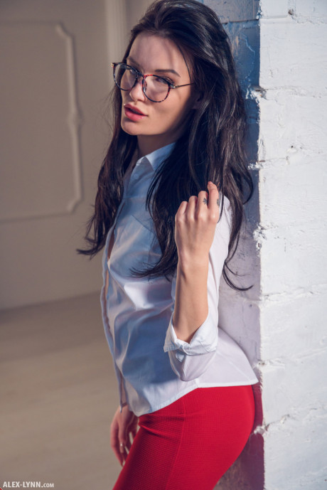 Glasses wearing female admires herself in a mirror while disrobing - #1276778