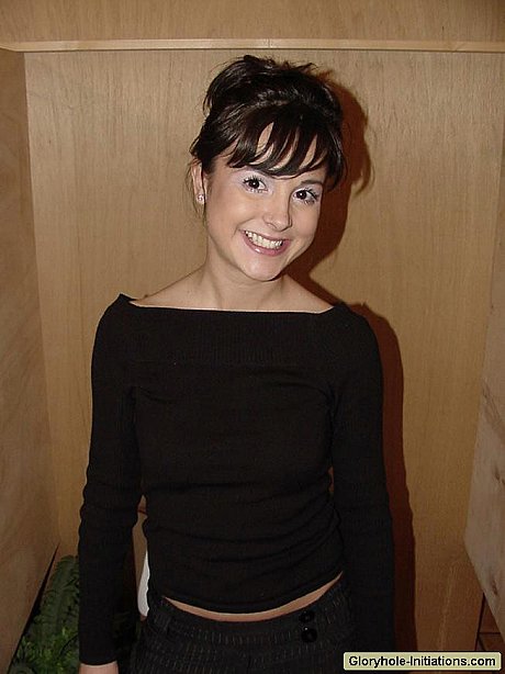 Tasty brunette Brit gives hot head to a rod popped through the glory hole - Image 1 of 16  in Teen category   featuring Brit 