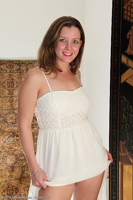 Hot redhead cougar mom Sally Jones modeling her small tits & perfect butt - Image 2 of 14  in Skirt category   featuring Sally Jones 