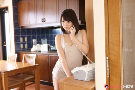 Japanese sweetie Mihono shows her natural titties while on the telephone - #1333613