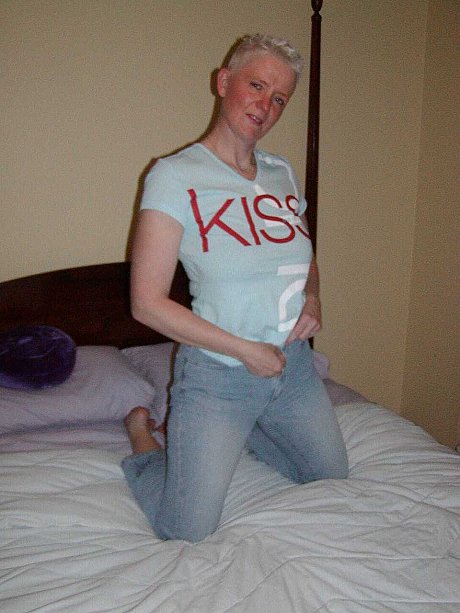 Older skank woman with short yellow-haired hair Tiffany Pearl gets undressed upon a bed - Image 3 of 16  in Pussy category   featuring Tiffany Pearl 