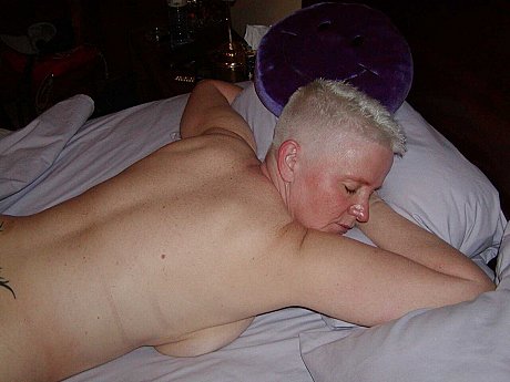 Older skank woman with short yellow-haired hair Tiffany Pearl gets undressed upon a bed - Image 12 of 16  in Pussy category   featuring Tiffany Pearl 