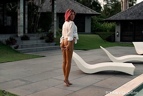 Redheaded babe Jenny stripping and teasing with her hot inked body poolside - Image 8 of 20  in Model category   featuring Jenny 