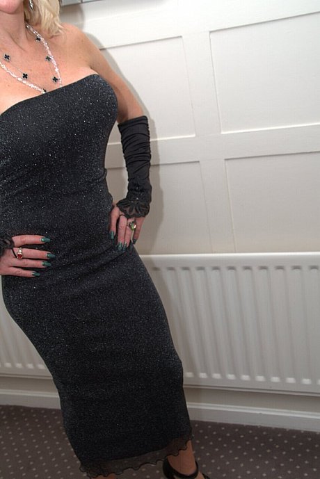 Old blondy Emerald models a Christmas outfit before a black hubby boy man kisses her - Image 11 of 16  in Skirt category   featuring Emerald 