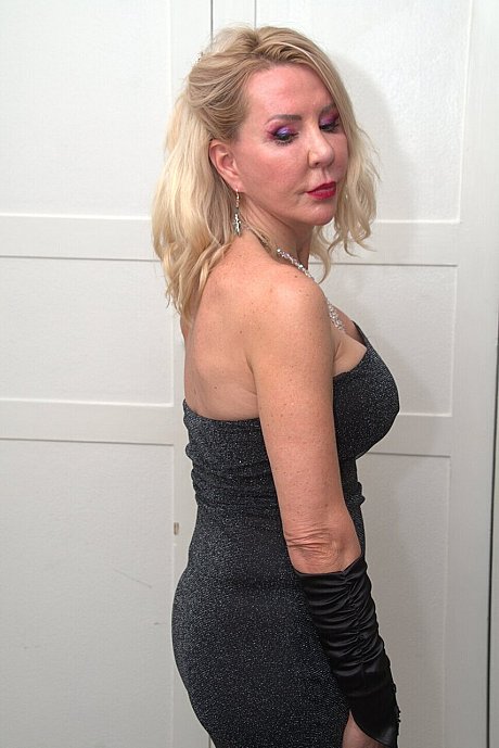 Old blondy Emerald models a Christmas outfit before a black hubby boy man kisses her - Image 15 of 16  in Skirt category   featuring Emerald 