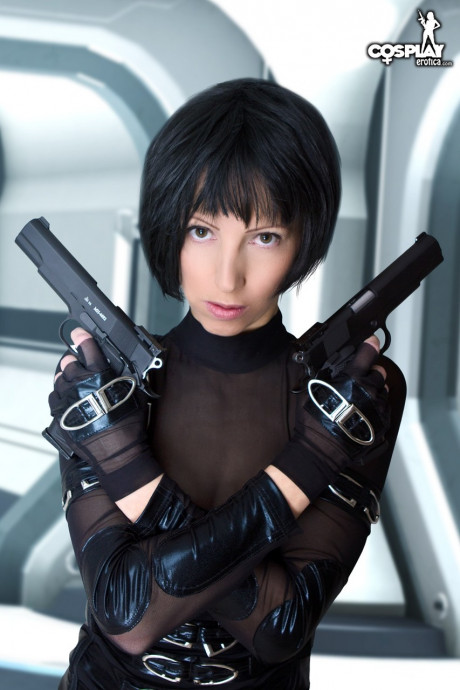 Cosplayer with short hair works her toned body partially free of her outfit