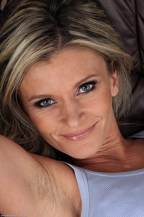 Thin MILF Carley strips and masturbates to cumming on the sofa - Image 2 of 20  in Big Clit category   featuring Carley 