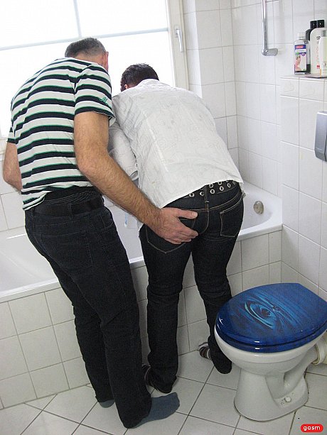 Short-haired German MILF gets her monstrous titties fucked in the bathroom