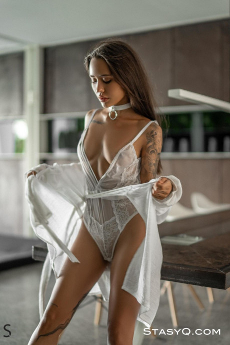 Alluring babe Camilla shows off her tattooed naked body in a hot striptease - #1219517