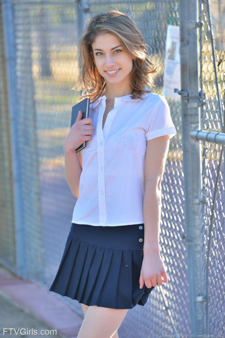 Thin teenie shows off her upskirt panties in her schoolgirl uniform on sidewalk - #550443